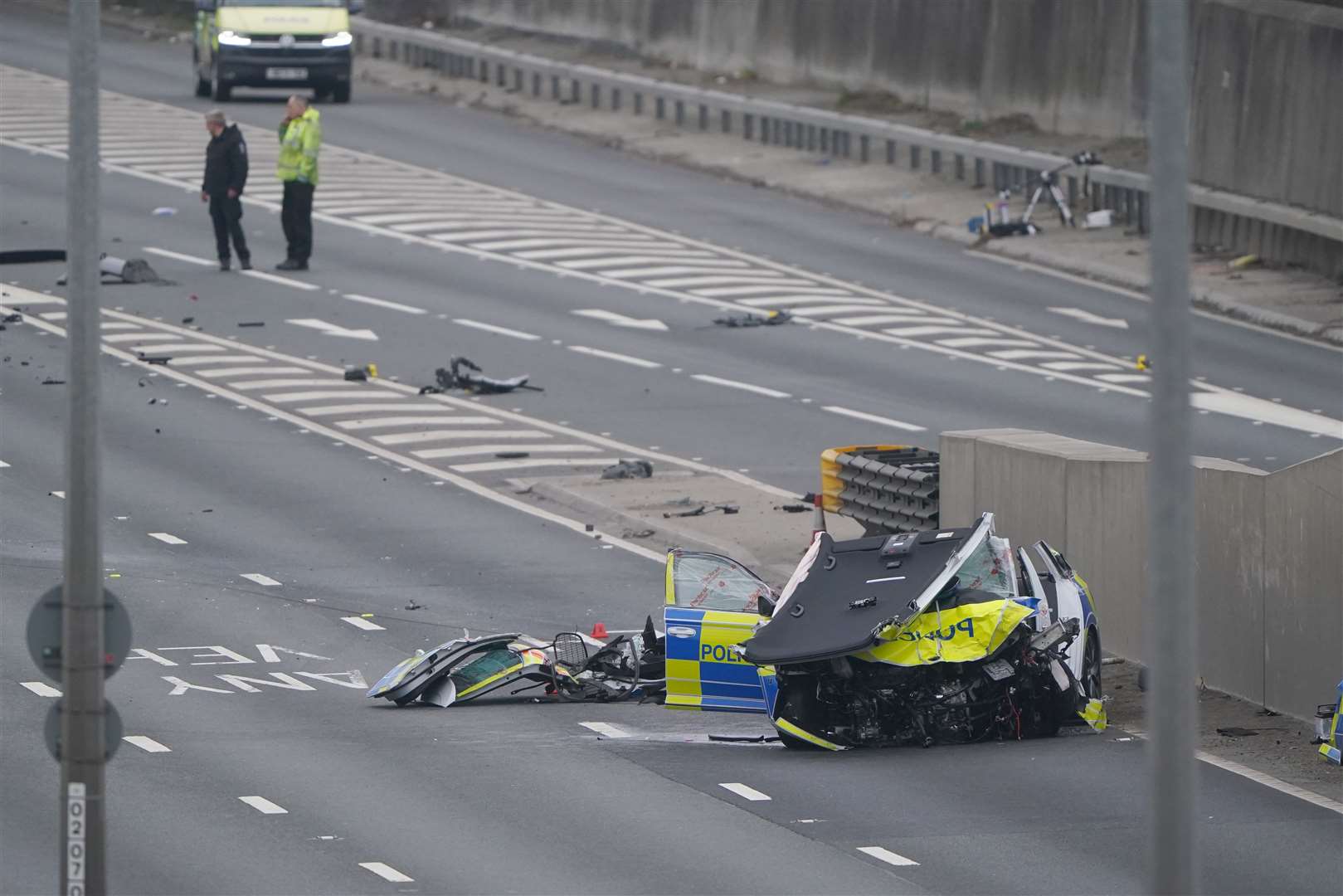 One of the police vehicles had its roof torn off (Owen Humphreys/PA)