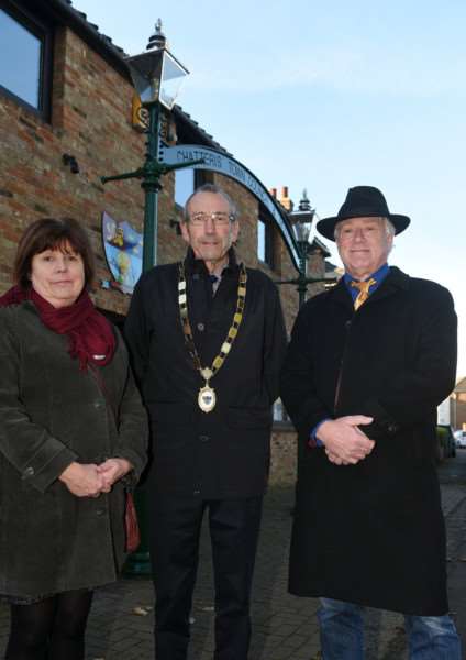 Cllr Julie Smith,Chatteris Mayor Bill Haggata and Chris Howes with newly restored gas lamps outside Chatteris museum