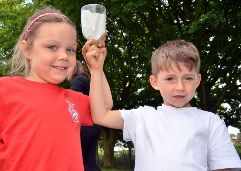 Zuzanna and Toby learn how to filter water. SG210616-135TW