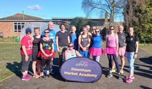 Three Counties Running Club members celebrate Tracey Else's 150th parkrun at Downham