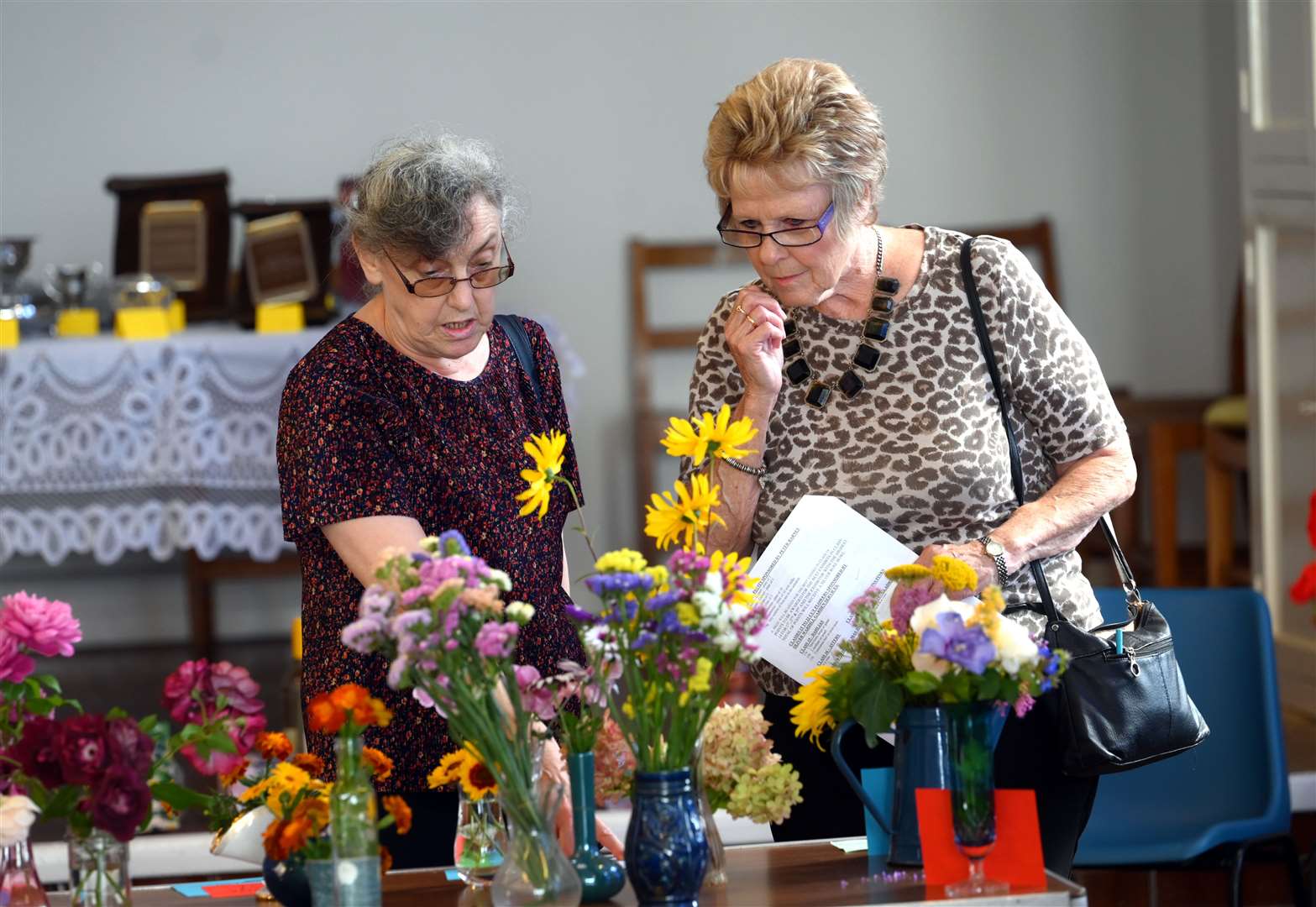 Pauline Murfitt and Ann Watson admire some of the floral entries.