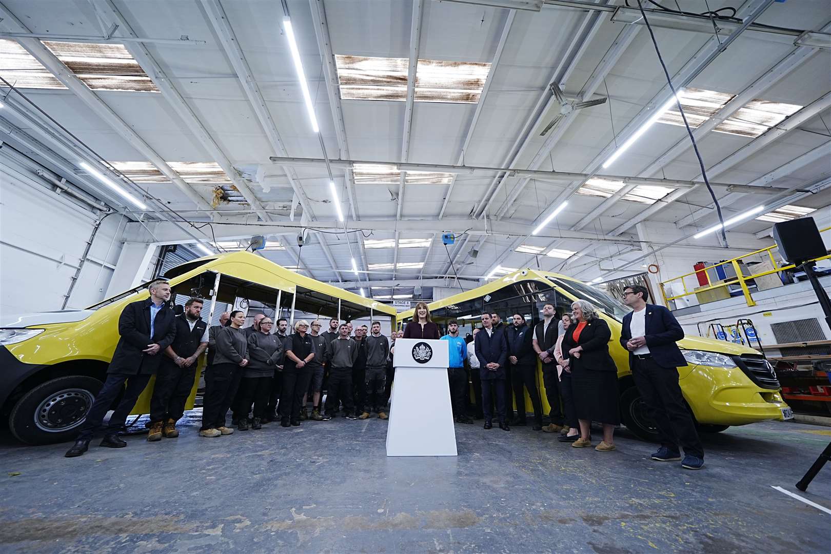 Rachel Reeves delivers a speech as Transport Secretary Heidi Alexander (second right) and Andy Burnham (right), Mayor of Greater Manchester, look on during a visit to Mellor Bus in Rochdale, Greater Manchester, earlier in June (Peter Byrne/PA)