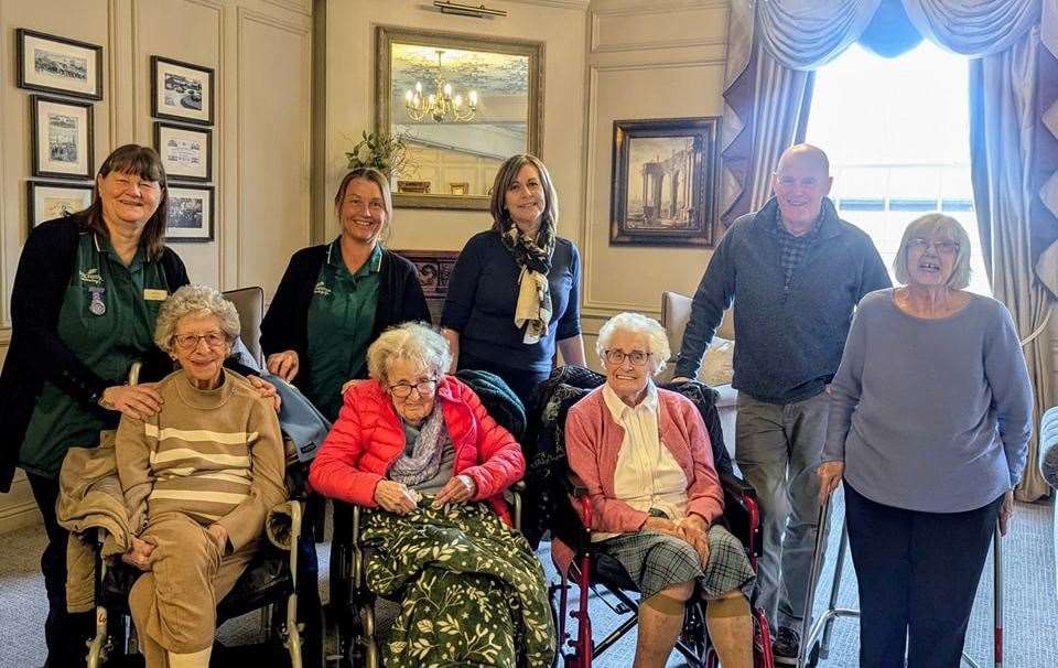 Betty, friends, family and staff exploring the Duke's Head Hotel