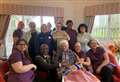Care home residents celebrates birthday with cake and family