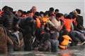 Migrant daily arrivals top 1,000 for first time this year