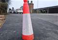 Residents baffled after cone left embedded in tarmac following sinkhole repairs