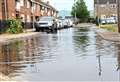 Road floods after heavy downpour