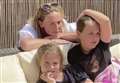 Hospital worker reunites with her daughters after nine weeks apart