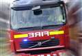 Crews extinguish fire in open on outskirts of town