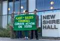 Residents gather outside council headquarters calling on action against climate