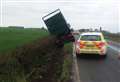 Police attend lorry that crashed into ditch and announce road closure 