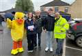 Crowds gathered to watch charity duck race