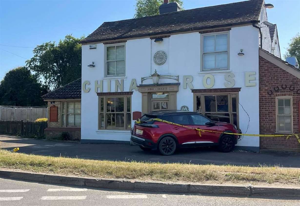 Woman crashes car into Chinese takeaway