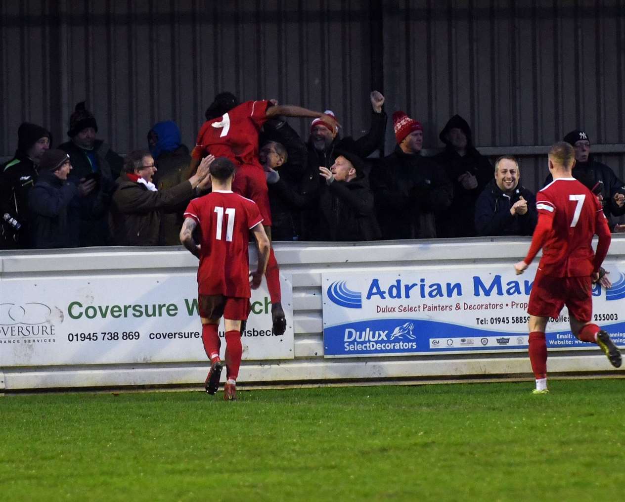 John Dean, Tiago Nassanculo and Danny Draper celebrate Wisbech's opening goal.