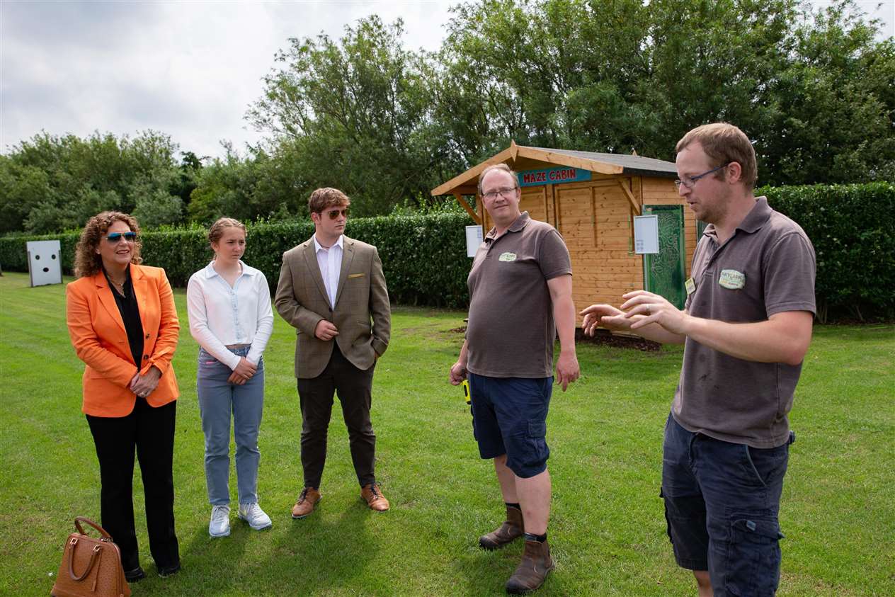 Pictured with Bart Woodbine (Events Manager)Hannah, Benji, Georgia Ingram-Moore visit the world's largest image of Captain Sir Tom Moore at Skylark Garden Centre. Photo: Terry Harris (49041288)