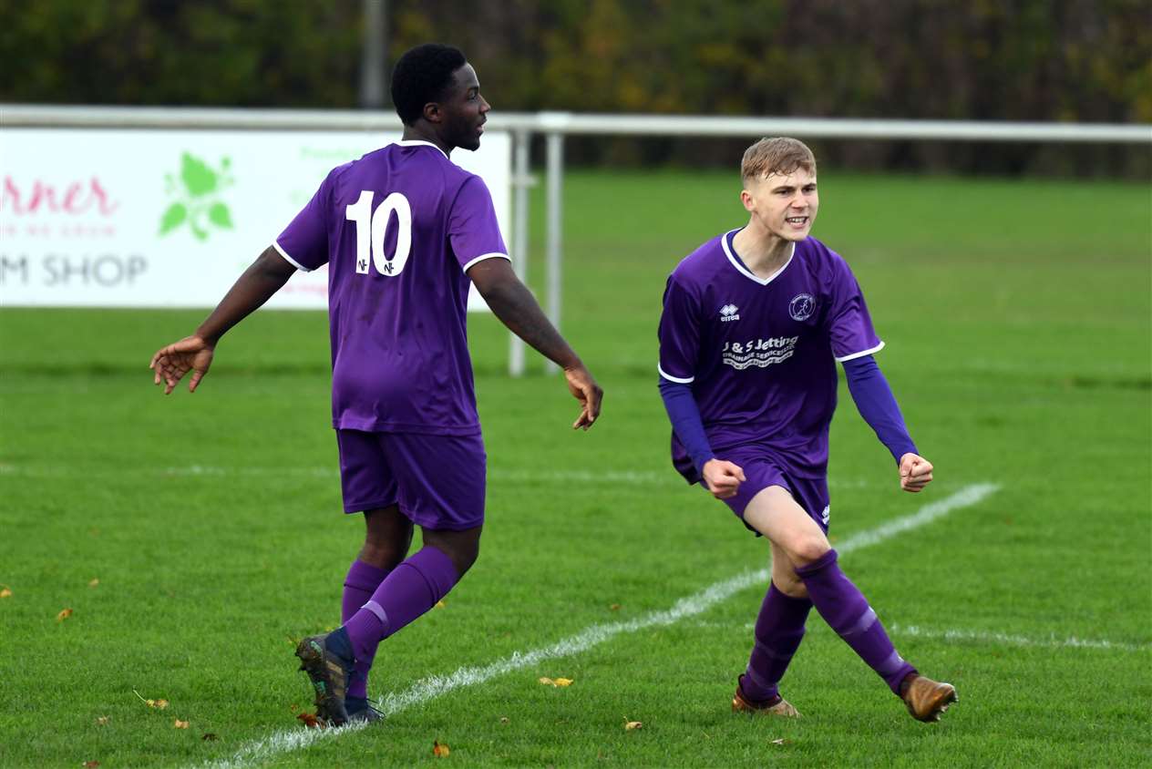 It's 2-0 and Edmilson Fernandes and Harvey Neale celebrate.