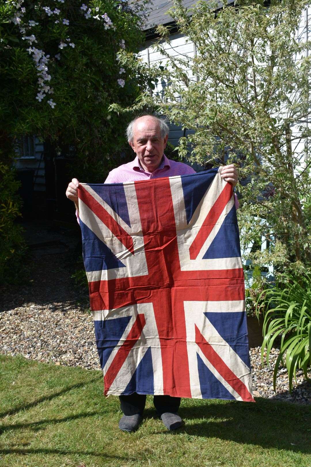 John Wing with the VE Day Union Flag he is giving to Wisbech Museum. (34326718)