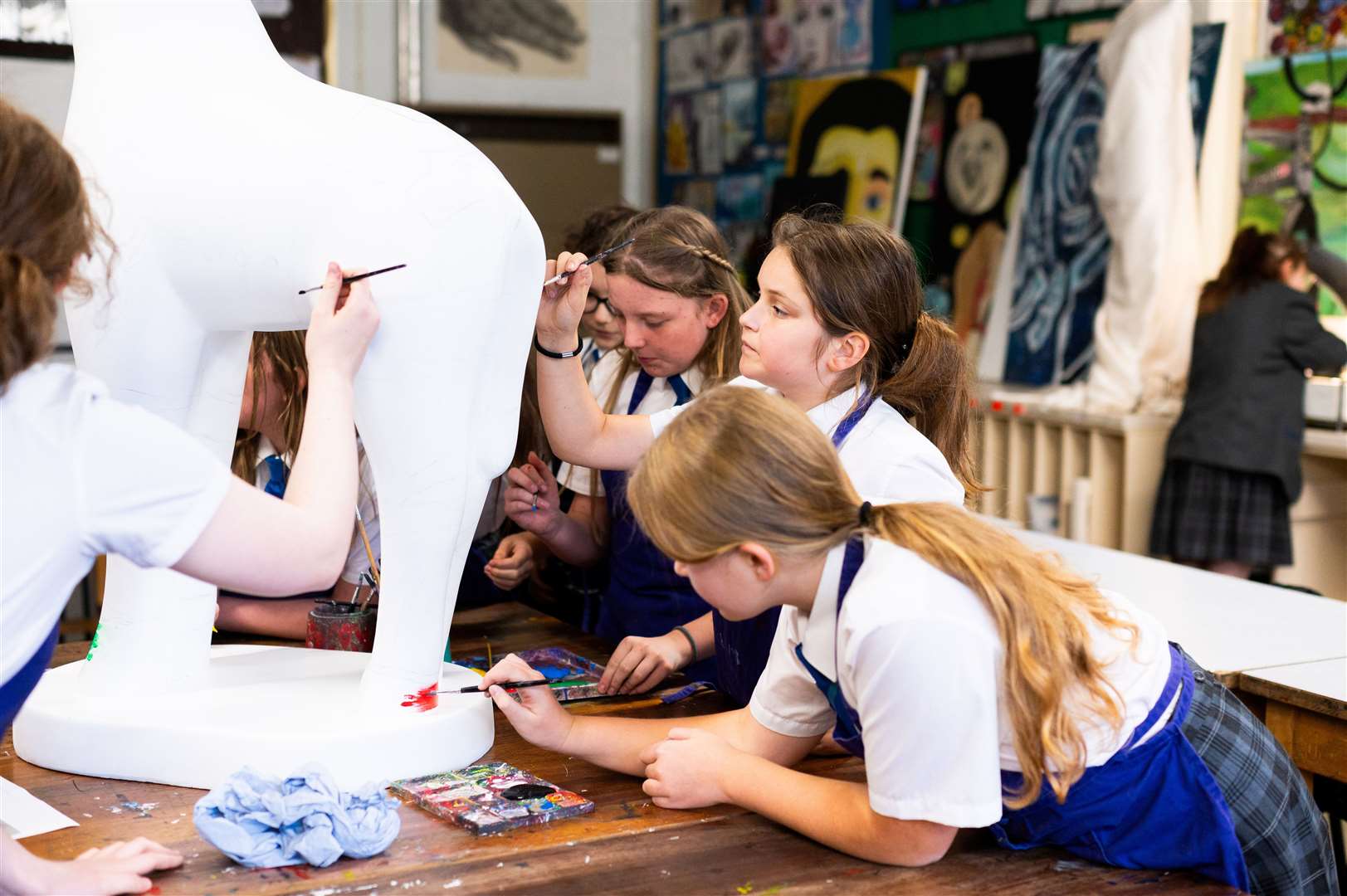 Students have designed and decorated a sculpture of Marsha the giraffe who will be part of the Cambridge Standing Tall exhibition in March. Photo: Barking Dog Media/Ian Burt.