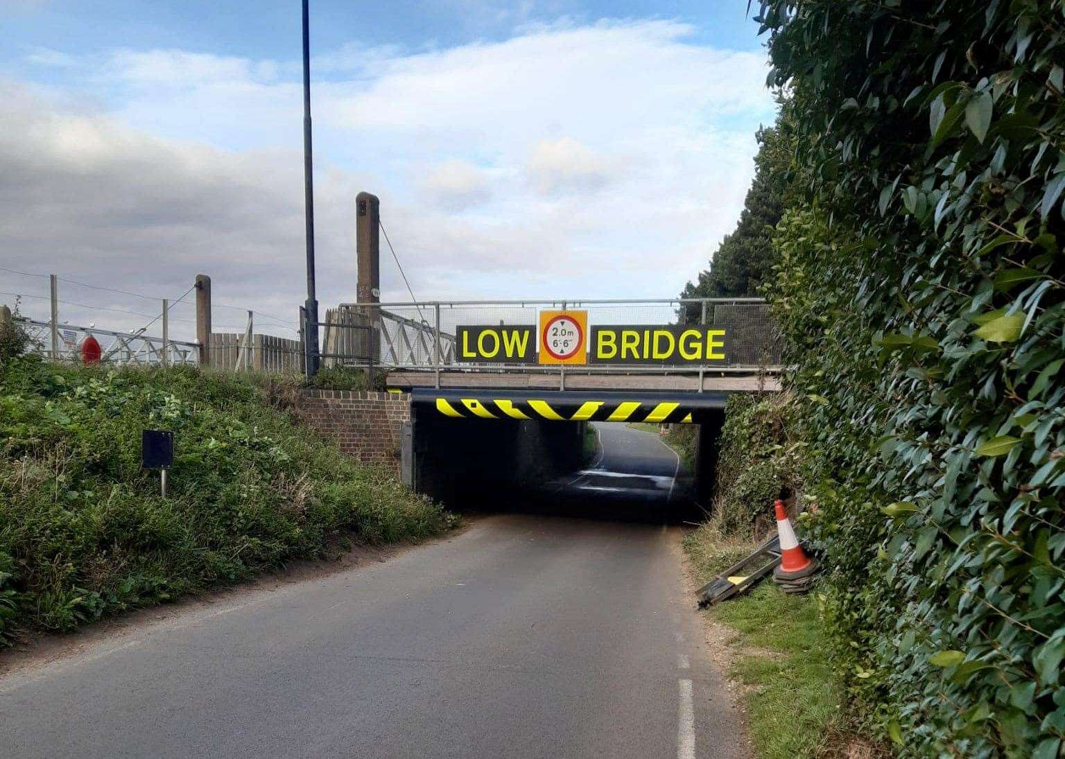 New signs have gone up on Stonea Underpass to try to avert future collisions - but campaigner James Fuller said it has already been hit multiple times. Photo: Graham Chappell.