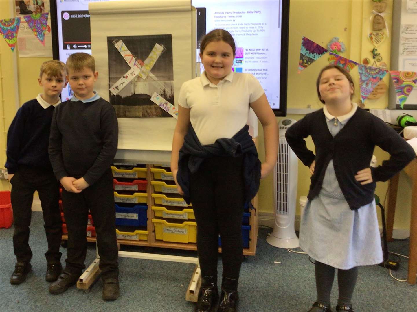 Albie, Sonny, Ava, and Laila from Year 3 playing ‘Pin the sail on the windmill’ to celebrate the federation's tenth anniversary
