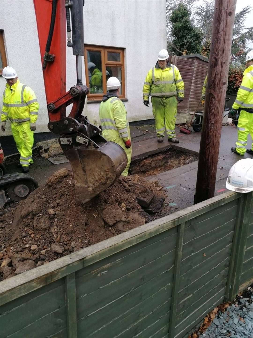 Workmen dig their first trench in a bid to find answers as too why three properties are badly subsiding in West End. (43350663)