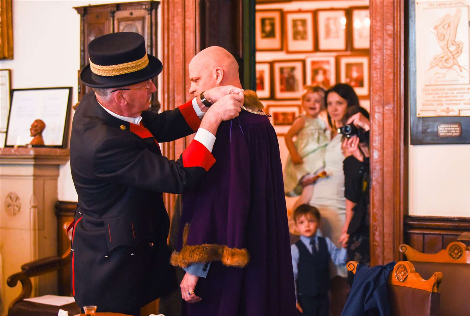 Cllr Aigars Balsevics is the new Deputy Mayor of Wisbech. Pictured here with Mace Bearer Trevor Longmuir and watched by his partner, Veronica, son Maximillian (3) and daughter Jessica (2).. (10027762)