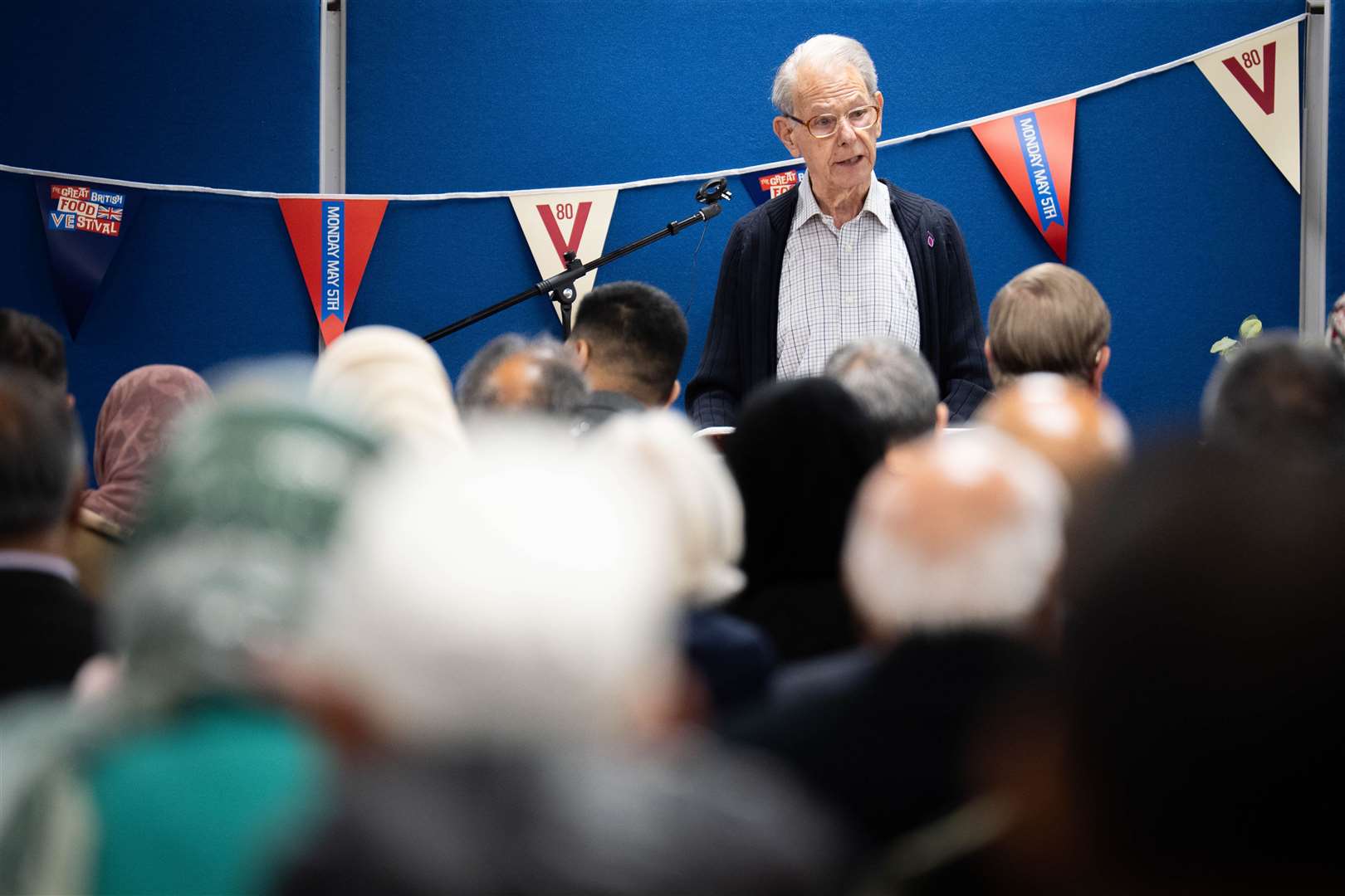 John Hajdu speaks to members of the Muslim community ahead of a VE Day 80th anniversary interfaith afternoon tea party, at the Shah Jahan Mosque in Woking (James Manning/PA)