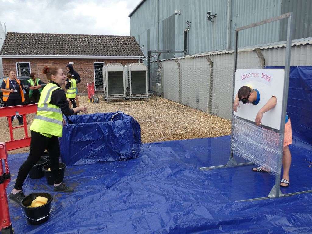 Senior staff at DHL in Wisbech got a soaking from employees for charity. (15437893)