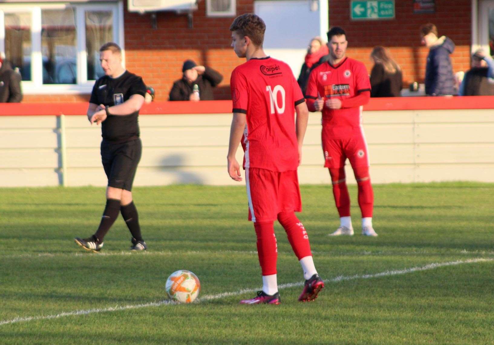 Ethan Wilson about to kick off for Wisbech Town against Boston Town. Picture: Erin Larham