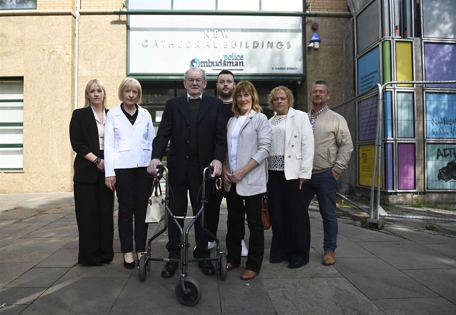Kingsmill massacre survivor Alan Black (third left) with relatives of John McConville outside the Police Ombudsman’s offices in Belfast (Mark Marlow/PA)