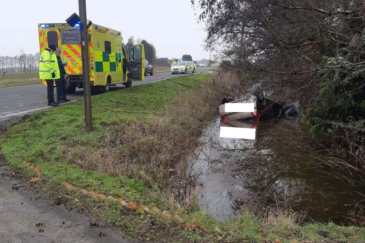 David McCreath waded in to save the driver of this overturned and submerged car.