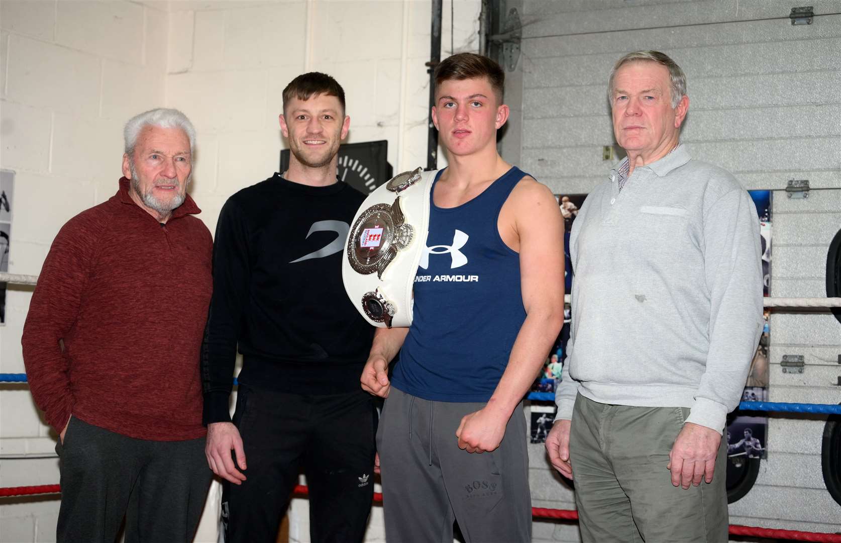 Harley Burrows with club members Frank Allen, trainer Matt Cox and head coach Dave Cole