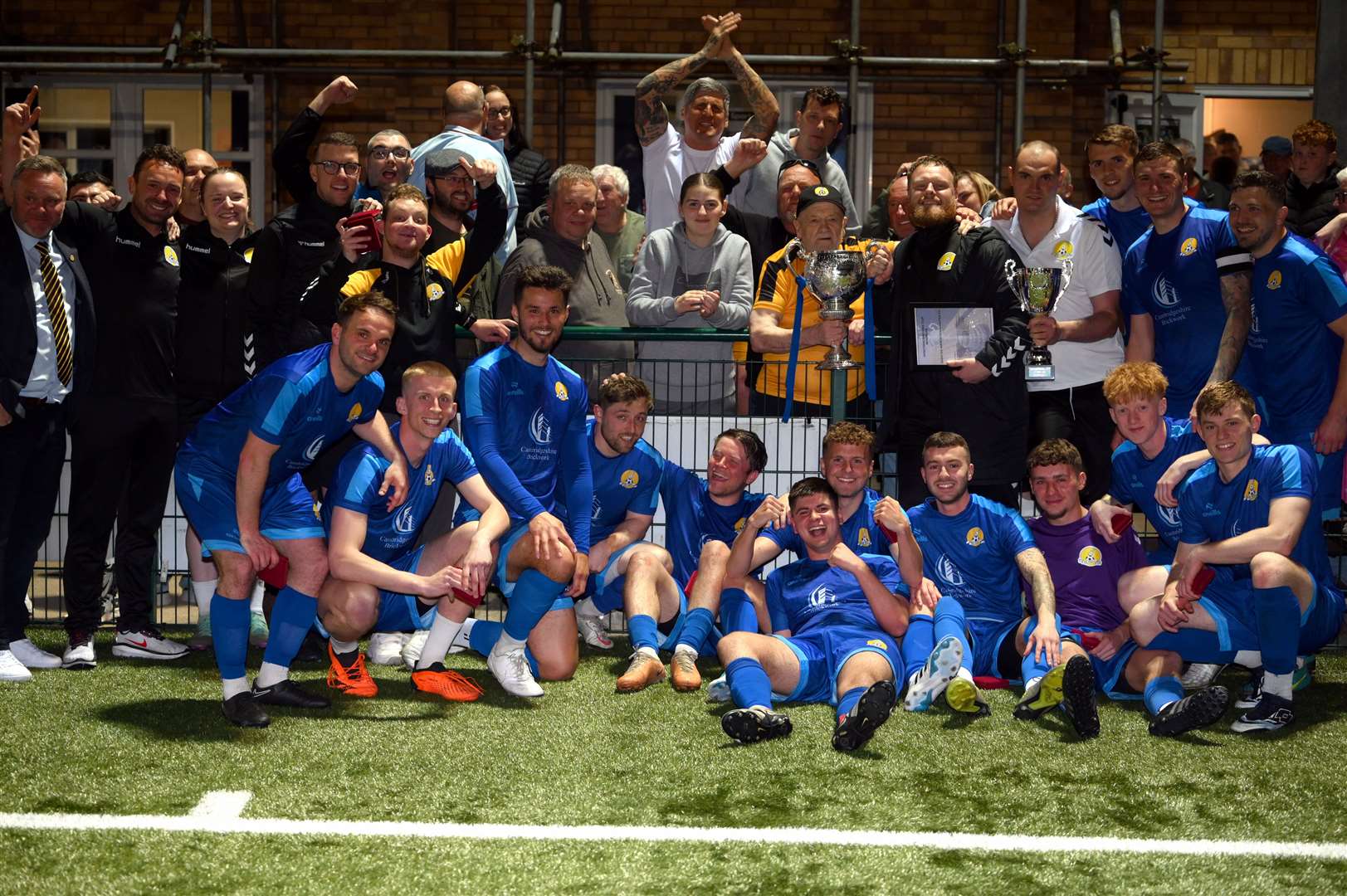 March (Blue) v Blackstones (Green and Black) in the final of the Hinchingbrooke Cup. March celebrate winning the cup