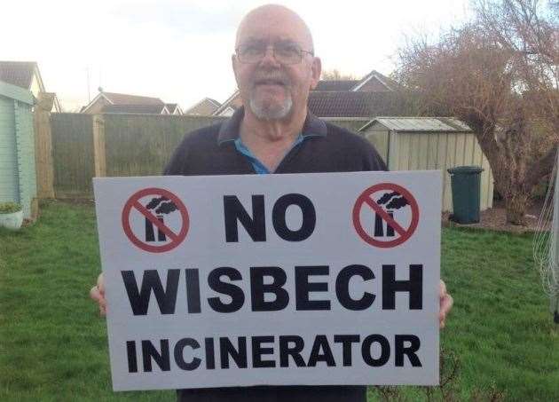 WISWin campaigner Michael Bucknor, with one of the specially printed placards for Sunday's rally. (29220220)