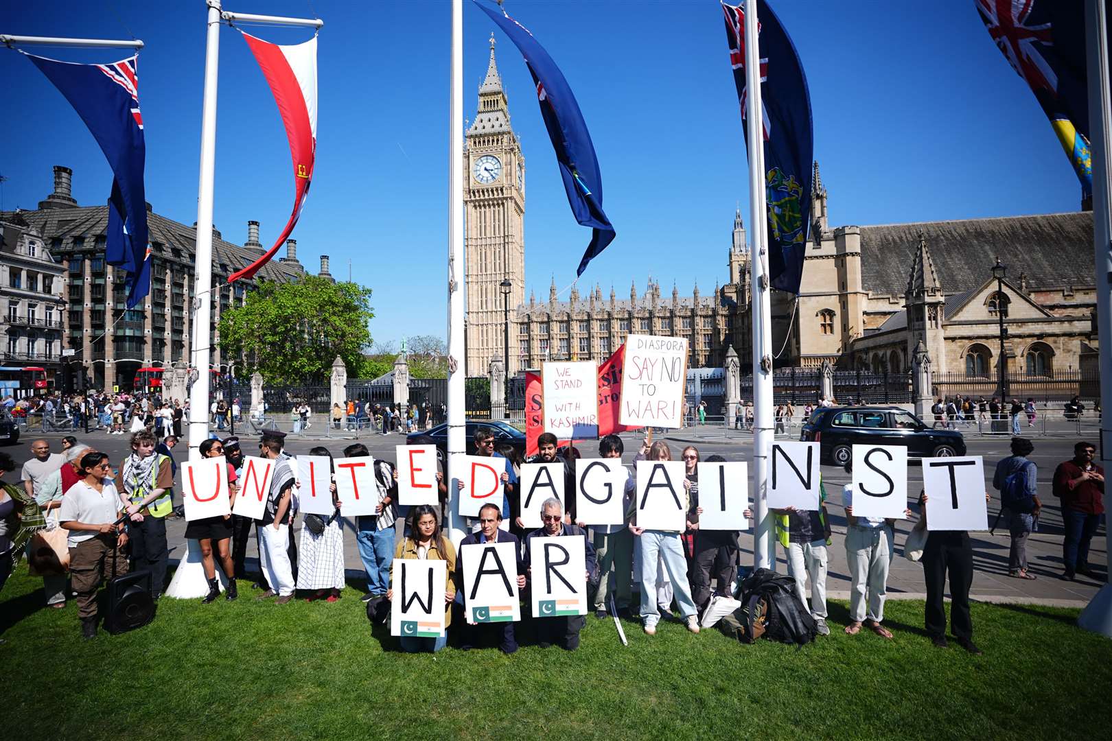 People take part in a demonstration in Parliament Square organised by the South Asia Solidarity Group (SASG) (James Manning/PA)