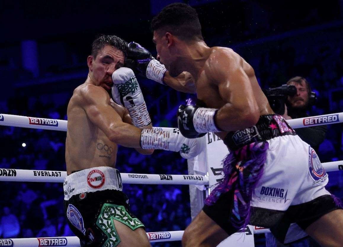 Jordan Gill lands another hard punch against Michael Conlan. Picture: Mark Robinson (Matchroom Boxing)