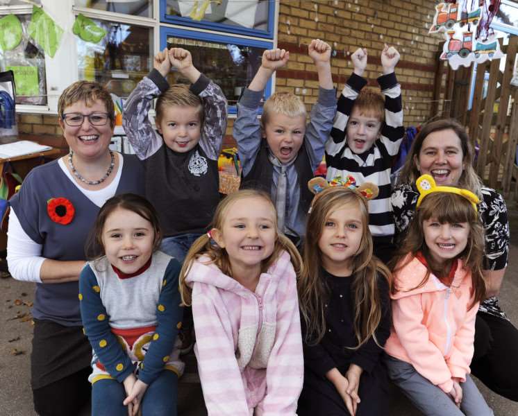 Early years pupils from Pine Class at Manea Community Primary School celebrate Ofsted success with headteacher Nicky Froggatt (left) and deputy headteacher Lisa Stevens, during a dress down day for Children In Need.