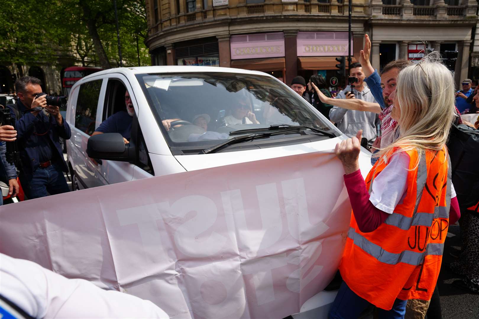 The vehicle appeared to face-off with protesters (Jeff Moore/PA)
