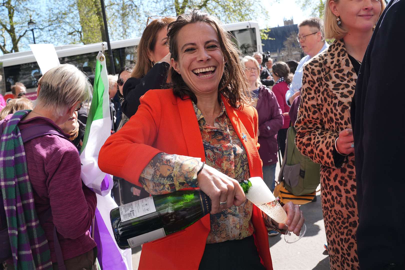 Campaigners celebrating outside the Supreme Court after the ruling that terms ‘woman’ and ‘sex’ in the Equality Act refer to a biological woman and biological sex (Lucy North/PA)