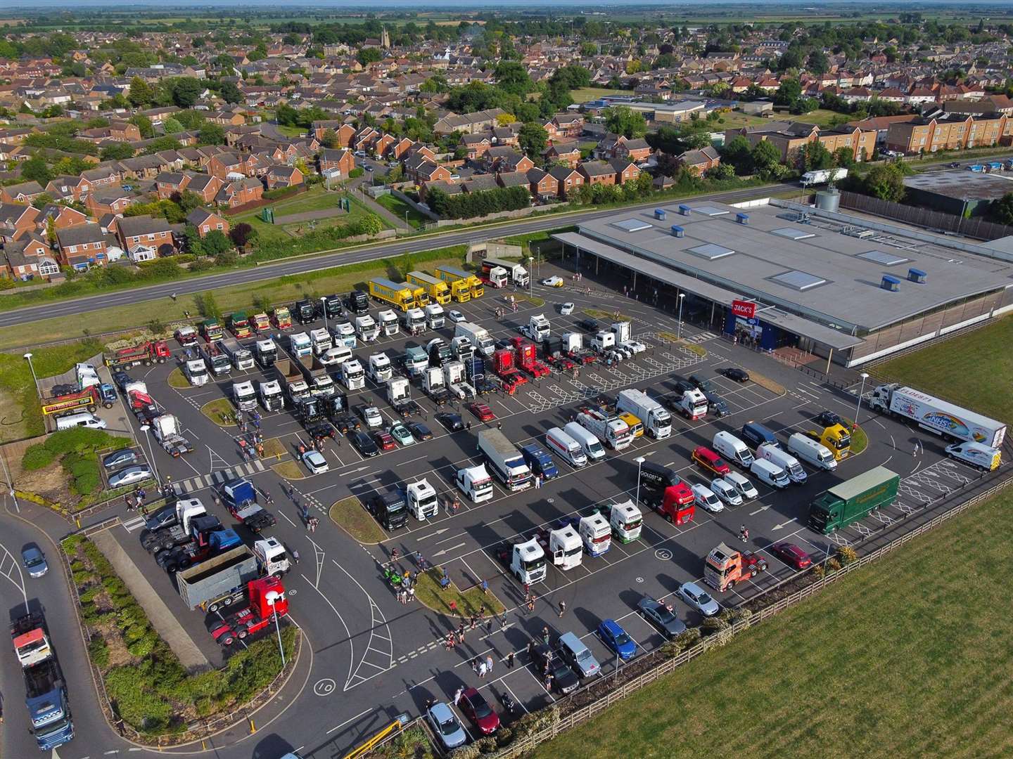 Around 70 lorries gathered at Jack's supermarket car park before heading in convoy to Peterborough City Hospital to pay tribute to the NHS. Photo: X21 Photography. (35232619)