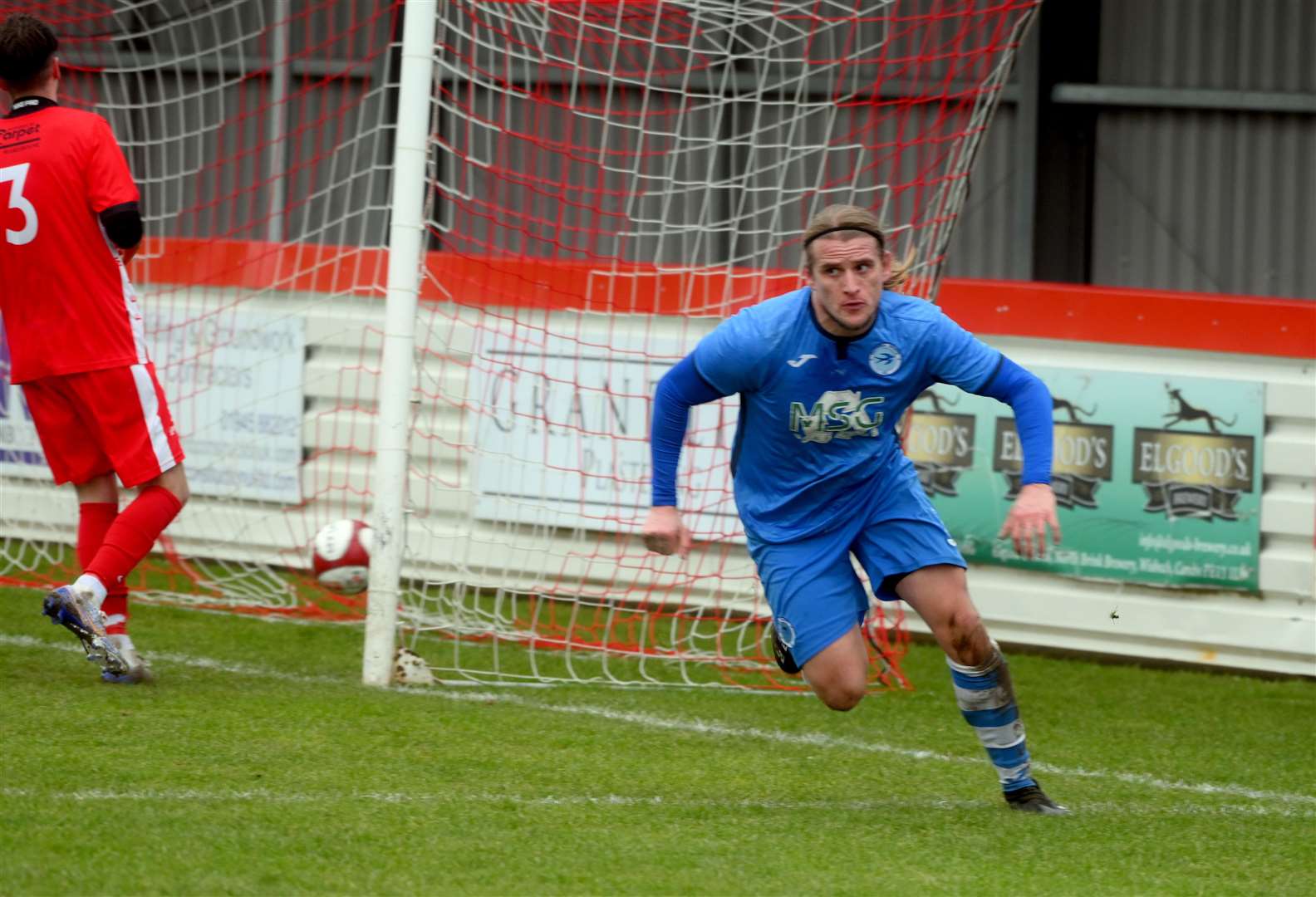 Jack Brand celebrates making it 2-1 to Outwell Swifts