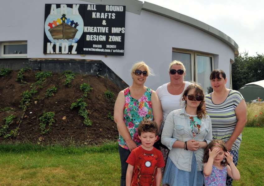 Denise Crowley, Yvonne Bingham and Charlotte Bingham with their first customers at the opening day last July. (SG040715-103TW)