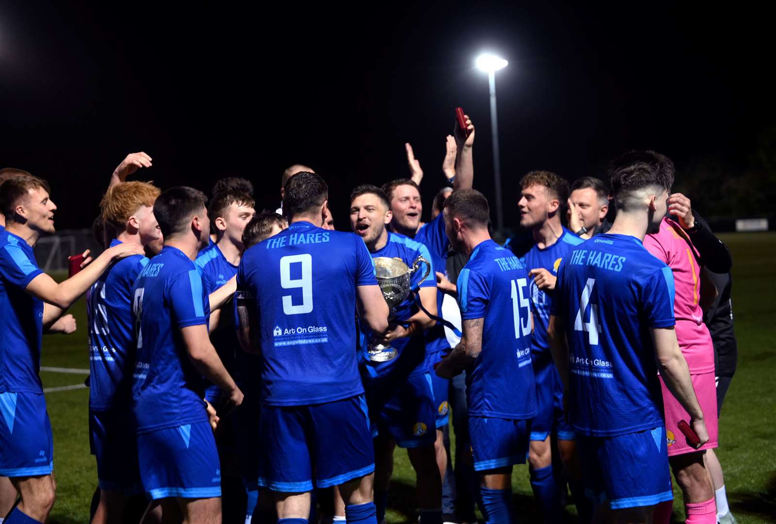 March (Blue) v Blackstones (Green and Black) in the final of the Hinchingbrooke Cup. March celebrate winning the cup