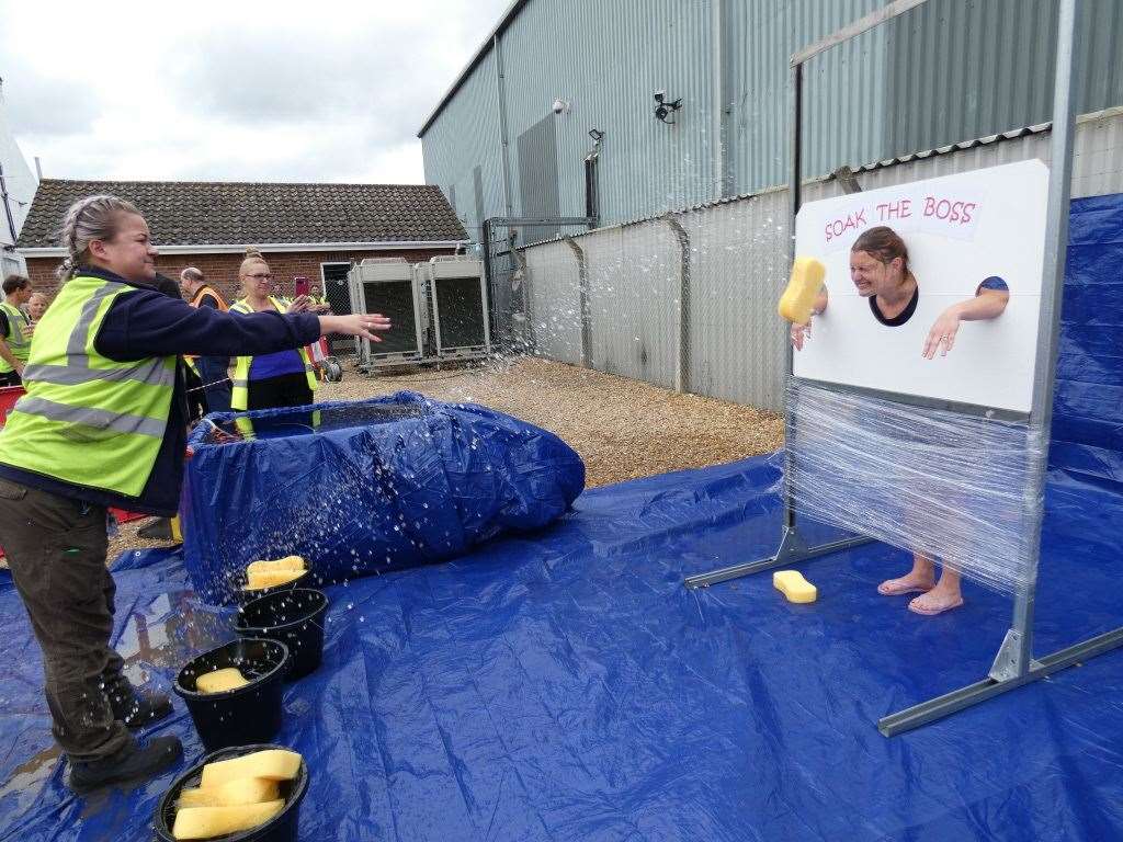 Senior staff at DHL in Wisbech got a soaking from employees for charity. (15437898)