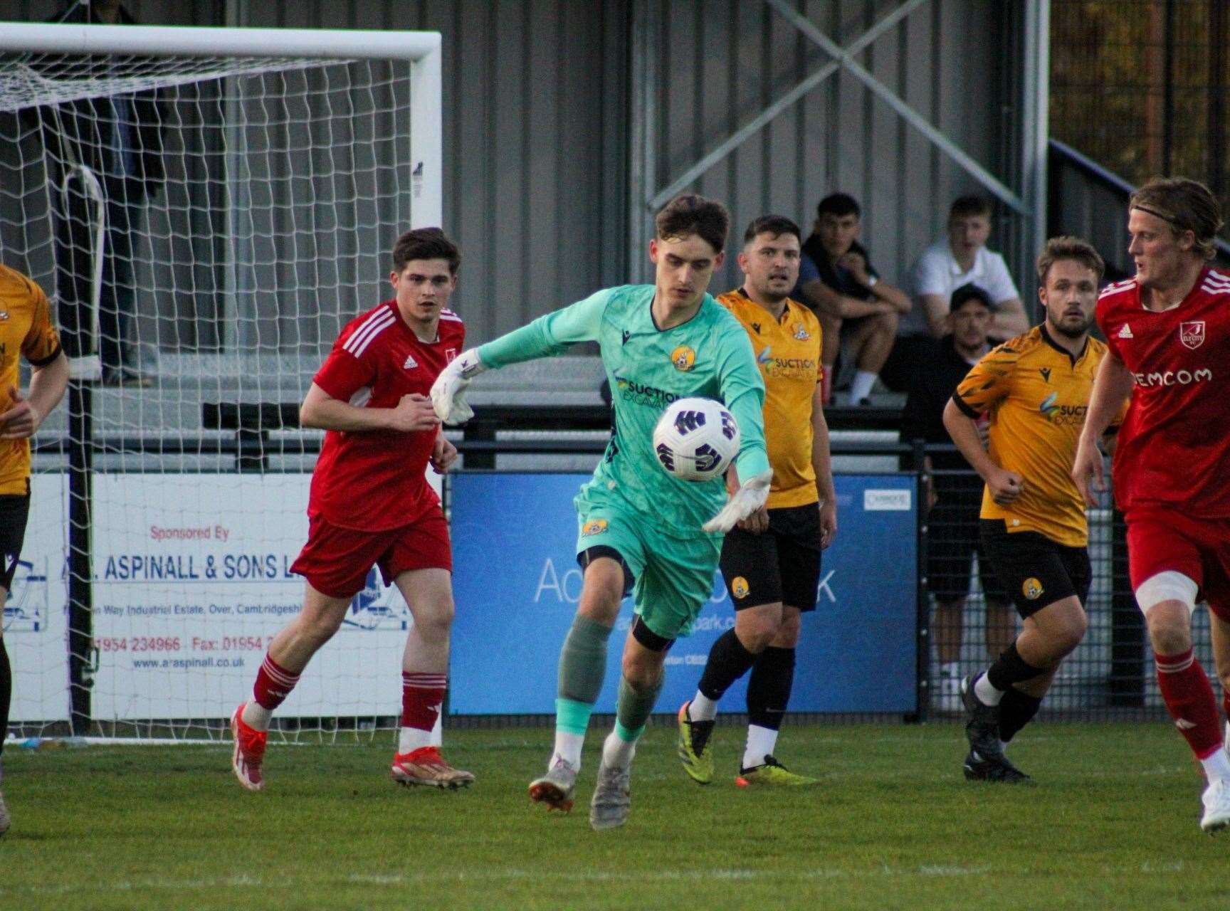 Goalkeeper Jonah Gill with ex-March striker Jack Friend in the background. Picture: Amber Kent
