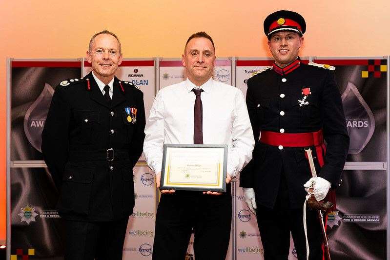 Darren Biggs receives his long service award. (55588204)