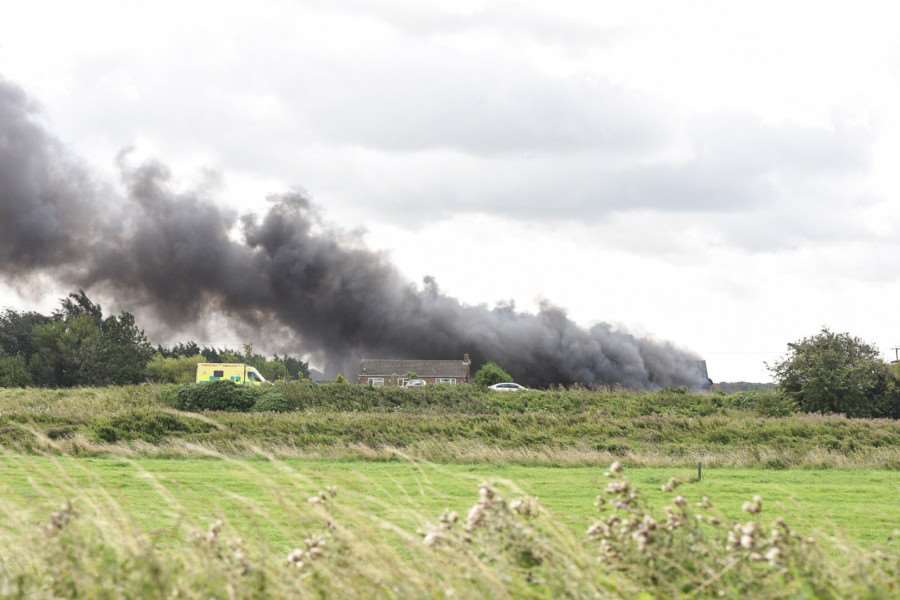 Fire crews tackle a farm fire off South Brink near Wisbech. It sending smoke billowing across the A47 causing problems for drivers.