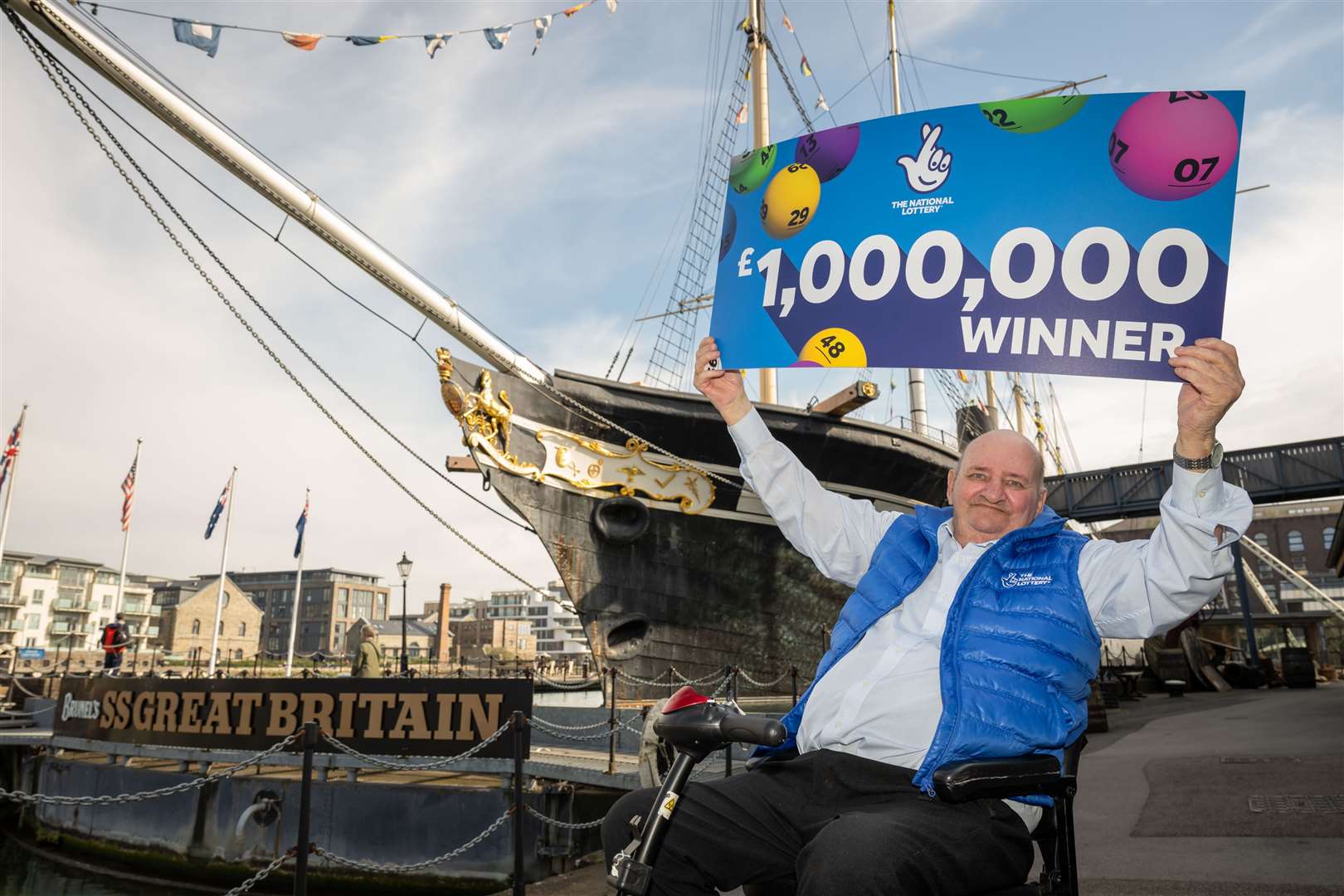 Mr Wilcock plans to buy himself a new mobility scooter with his winnings, and throw a party for his friends (Allwyn/National Lottery/PA)