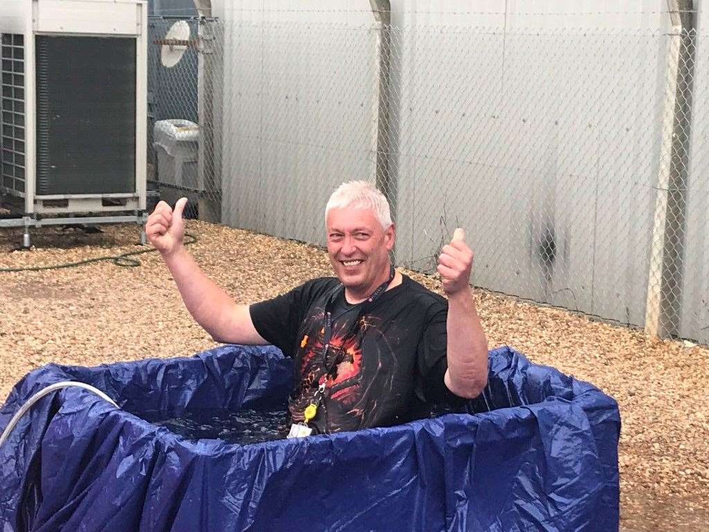 Senior staff at DHL in Wisbech got a soaking from employees for charity. (15437900)