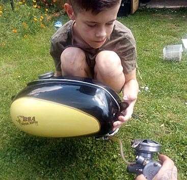 Reece surveying the work he needed to carry out on the bike.